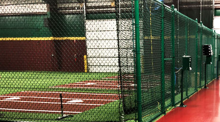 Indoor batting cages at a D-BAT academy